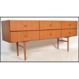 A 20th Century retro teak wood Sideboard / Credenza, having an arrangement of six drawers raised