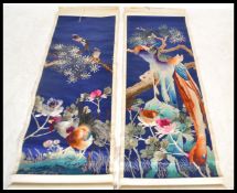 Two vintage 20th century Chinese silk scrolls having hand embroidered decoration depicting birds