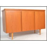 A retro 20th Century Danish three door teak wood Skovby sideboard, the left hand side cupboard