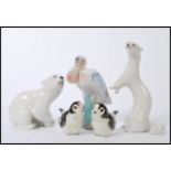 A group of vintage USSR ceramic figures to include polar bear, weasel etc. Along with other