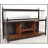 A vintage mid 20th Century Tola wood and ebonised shelving system in the manner of G-Plan Librenza