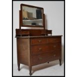 A late Victorian / Edwardian mahogany dressing table chest of drawers. The large swing mirror