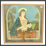 A framed and glazed oil on board painting of Madonna and Child signed by John A Malcolm, the