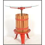 A 20th Century contemporary side table / coffee table modelled as a cider press / cheese press,