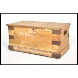 A 19th Century Victorian scrumble finished pine trunk / work-box, hinged top raised on a plinth