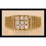 A hallmarked Art Deco Style 18ct gold and diamond ring having nine diamonds in square formation with
