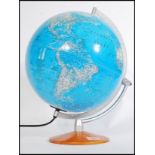 A vintage retro 20th century desk top globe raised on a circular wooden base. 44cm-high.