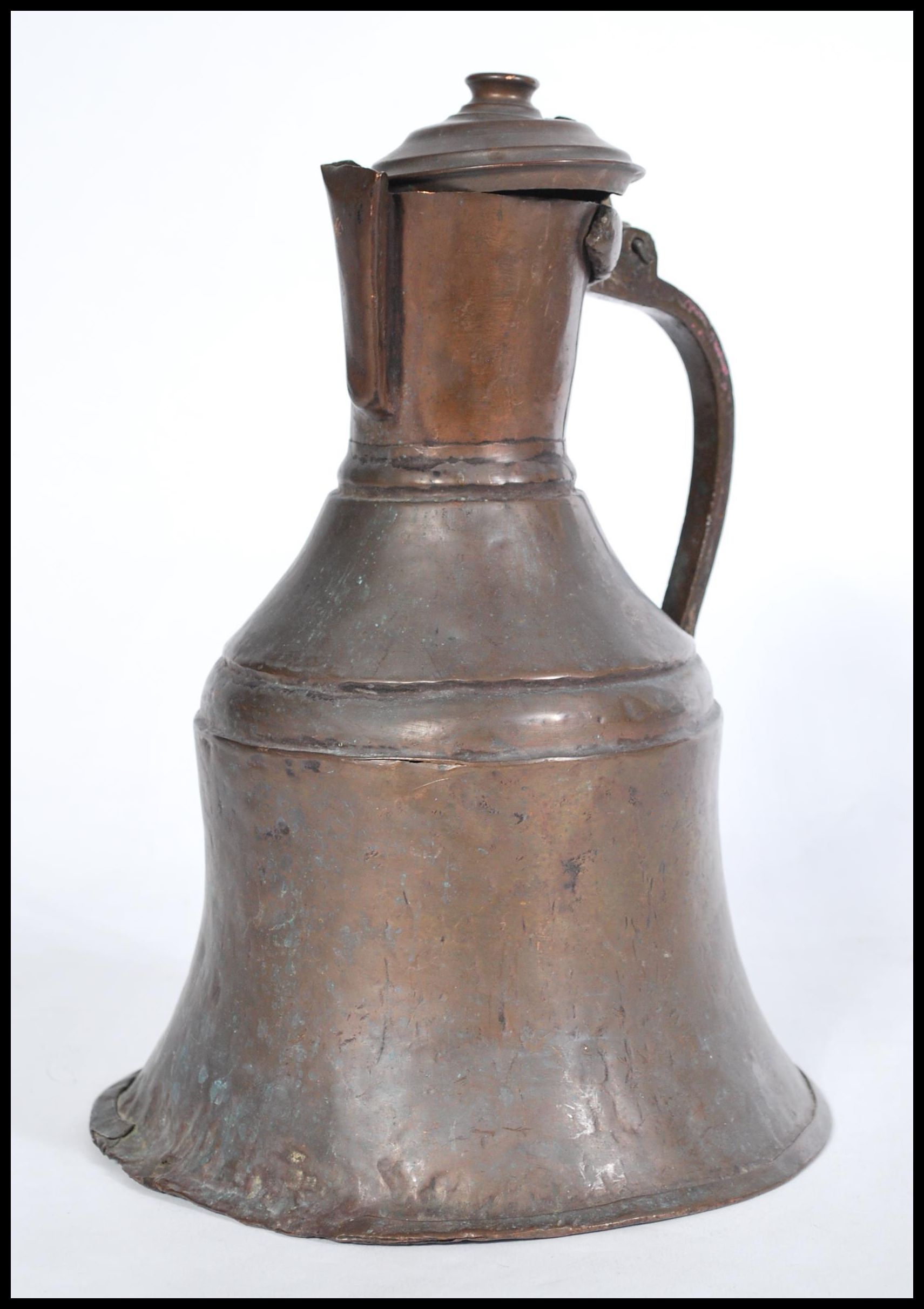 An 19th century middle eastern Persian Islamic brass and copper coffee pot Dallah, probably Turkish.