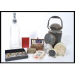 A collection of vintage items to include a vintage early 20th century railway lamp, vintage alarm