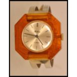 A vintage retro 1970's Belair ladies watch with a round face and stick batons to the chapter ring,