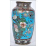 A 19th century Chinese cloisonne vase with blue enamelled panels to the sides depicting peonies