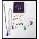 A selection of ladies jewellery to include a silver white metal ring set with a central sqaure cut