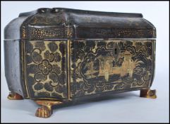 A 19th century Chinese lacquer box raised on ormolu claw feet. The box of octagonal sarcophagus