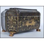 A 19th century Chinese lacquer box raised on ormolu claw feet. The box of octagonal sarcophagus