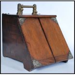 A 19th century Victorian oak coal scuttle box having metamorphic twin door lever action complete