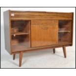 A vintage 20th Century walnut cased radiogram unit, having a later conversion in to a drinks cabinet