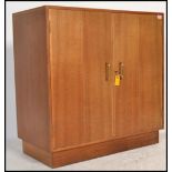 A stunning vintage 20th Century science lab wooden cabinet, fitted with a double full length doors