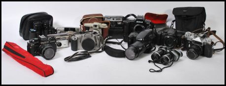 A large collection of vintage camera's to include Zenit E SLR, Praktica SLR, Lumix, Olympus,