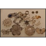 A selection of ornate filigree metal jewellery to include a floral spacer bracelet with safety chain