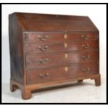 An 18th century George III large mahogany bureau being raised on bracket feet with chest of