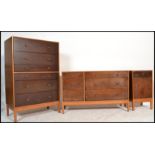 A vintage mid 20th Century three piece bedroom suite, consisting of a tall straight chest of drawers