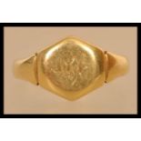 An early 20th century hallmark 18ct gold gentlemans signet ring. The ring has notation on the inside