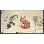 A group of four 20th century Japanese wood block prints on scrolls depicting traditional scenes with