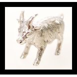 A sterling silver figurine in the form of a goat. Weight 13.5.