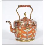 An early 20th century copper kettle teapot having silver overlay leaf decoration with brass flower