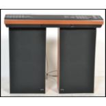 A vintage retro 20th century Bang and Olufsen B&O Beocenter 4000 music system complete with a pair