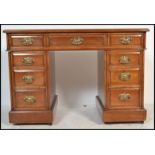 An Edwardian twin mahogany pedestal desk being raised on plinth bases, each pedestal with banks of