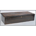 A 19th century cylinder music box of rectangular form with brass cylinder. The mahogany box with