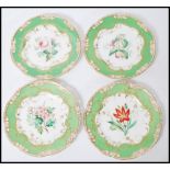 A set of four 19th Century ribbon cabinet plates having pierced green rims with gilt detailing and