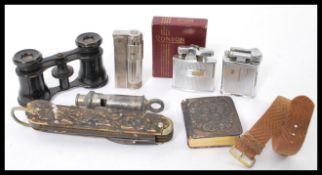 A collection of vintage items to include a stag horn multi tool knife. vintage watch, lighter, opera