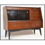 A 1970's G-Plan Librenza tola wood sideboard / credenza / highboard raised on an ebonised suspension