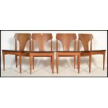 Elliots of Newbury - A set of four vintage 20th century teak dining chairs having black vinyl