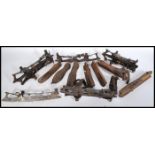 A collection of antique ice skates dating from the 19th Century, many constructed from steel and