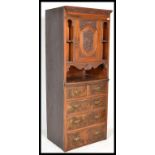 A late 19th Century walnut tall upright chest of drawers, a configuration of two short drawers
