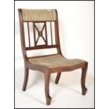 An Edwardian mahogany inlaid bedroom / nursing chair having line inlaid details with green velour