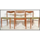 A group of three vintage / retro 20th Century teak wood Danish dining chairs in the manner of