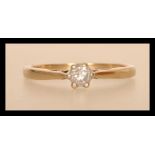 A hallmarked 9ct gold diamond solitaire ring having a central brilliant cut diamond of approx 25pts.