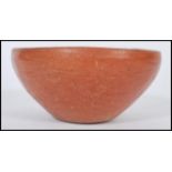 An ancient antique Roman pottery bowl. Simple red clay construction with Museum or collection
