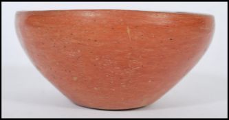 An ancient antique Roman pottery bowl. Simple red clay construction with Museum or collection