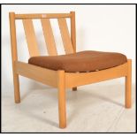 A vintage retro Ercol solid beech wood blonde low lounge chair, the chair fitted with new Ercol