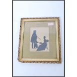 A late Victorian silhouette of a man and woman set within a gilt carved wood and gesso frame. 31cm-