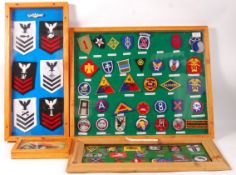 ASSORTED FRAMED AND GLAZED BRITISH AND US MILITARY PATCHES