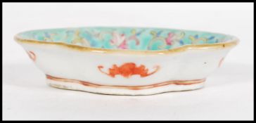 A 19th century Chinese small brush water dish having hand painted and enamelled with dragon and