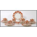 An early 20th century Wellington China six person tea service consisting of six cup, saucer and side