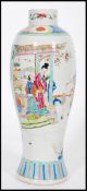 An early 20th century Chinese vase of bottle shape having cartouche panels depicting domestic