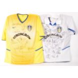 LEEDS FOOTBALL CLUB - PAIR OF HOME & AWAY AUTOGRAPHED SHIRTS